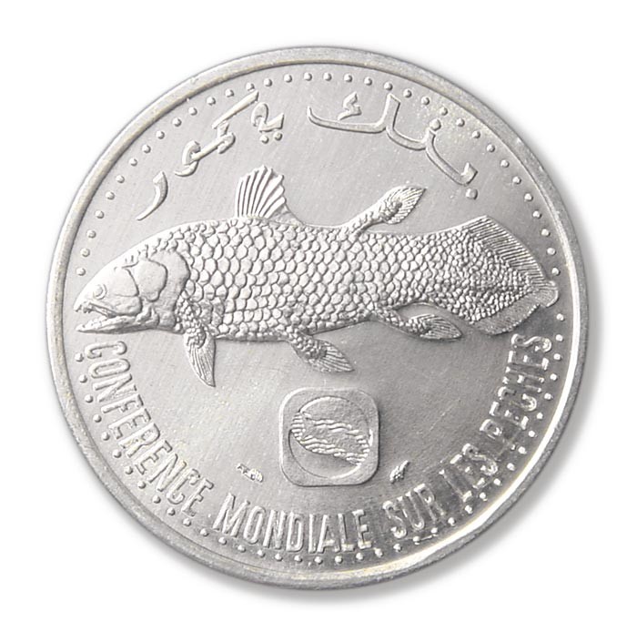 Silver 5-franc coin from Comoros featuring a coelacanth, symbolising national pride, marine protected areas, and living fossil conservation heritage.